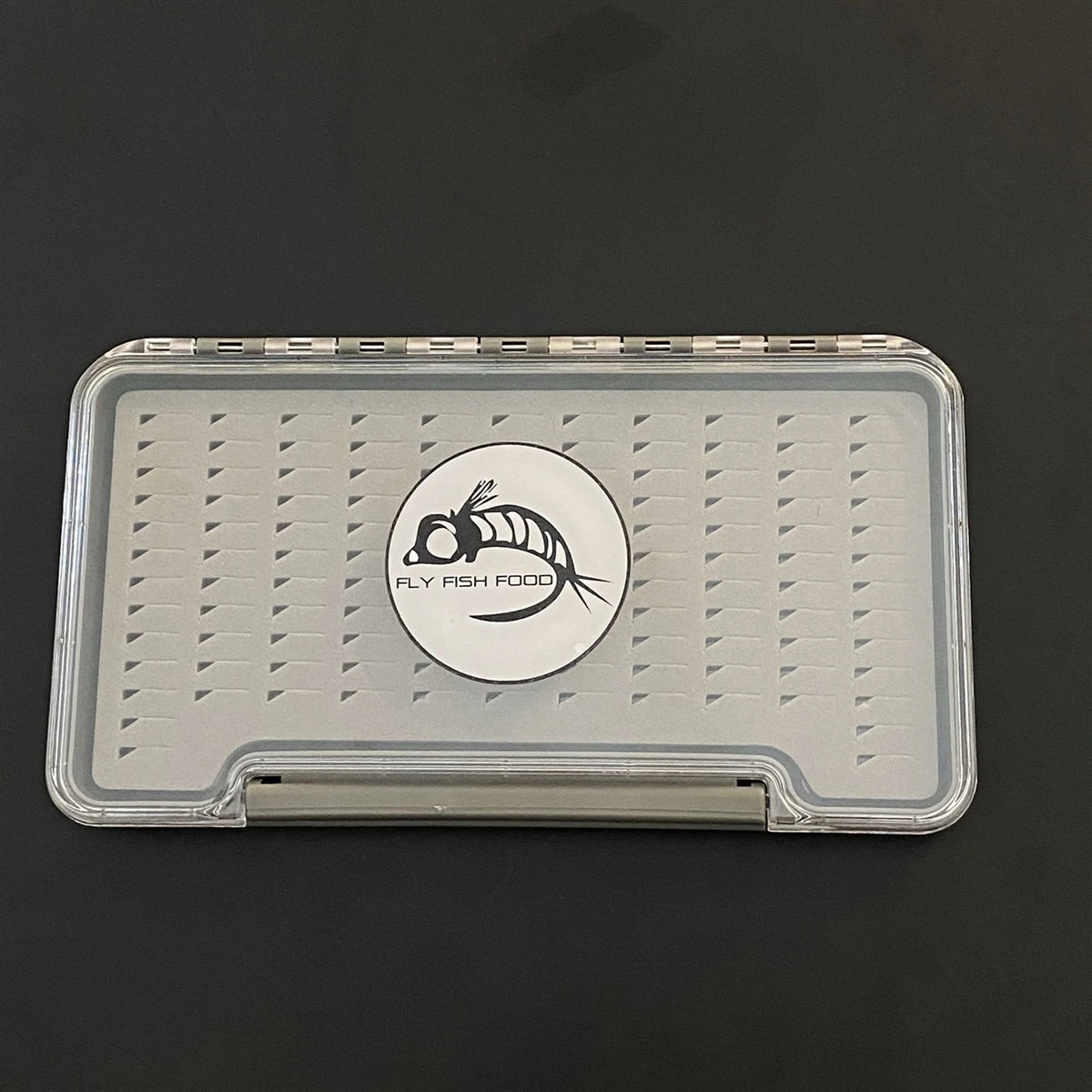 FLY FISH FOOD LOGO FLY BOX, CLEAR SINGLE SIDED - LARGE WITH EASY GRIP FOAM 1 FLY FISH FOOD LOGO FLY BOX, CLEAR SINGLE SIDED - LARGE WITH EASY GRIP FOAM